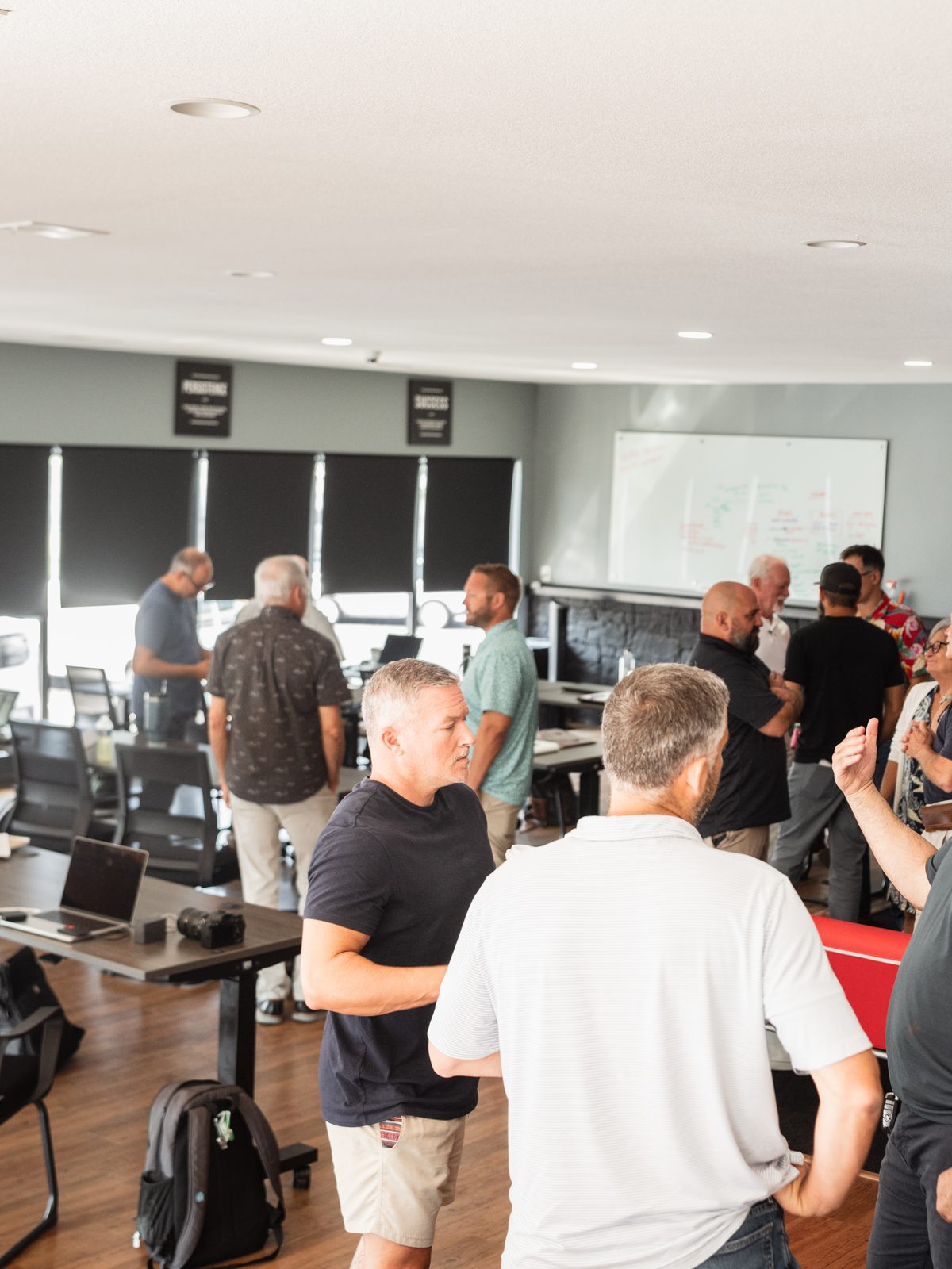 Members working the room between segments of a GEMS session