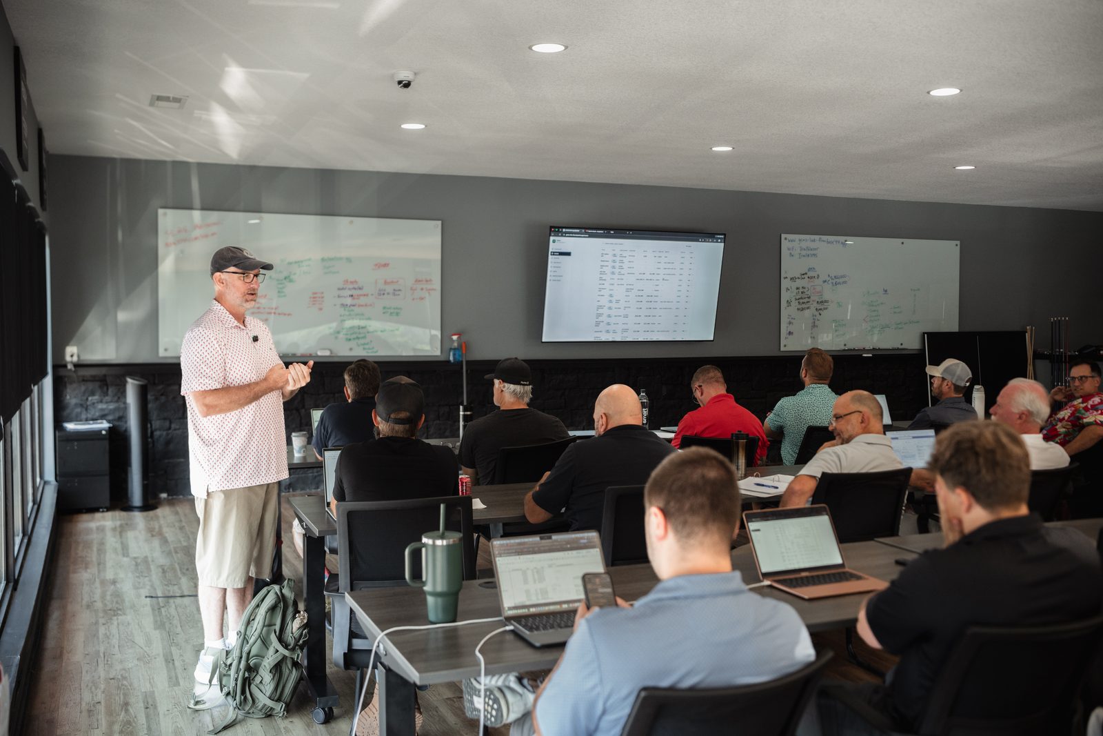 Jason Dillard working the board in front of the room at a GEMS session